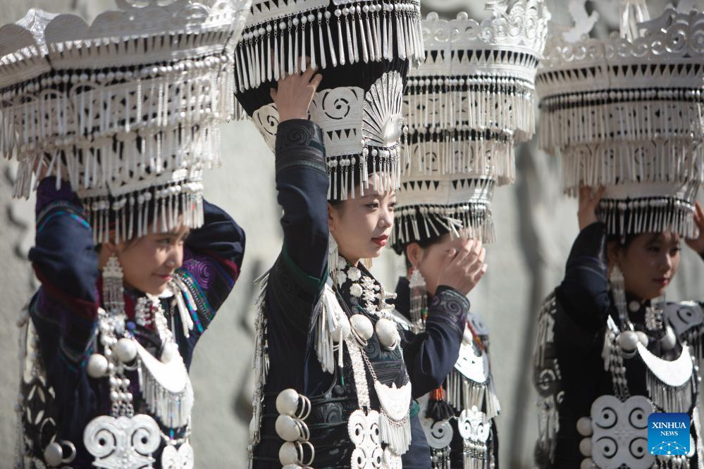 People dressed in traditional Yi costumes celebrate torch festival in China