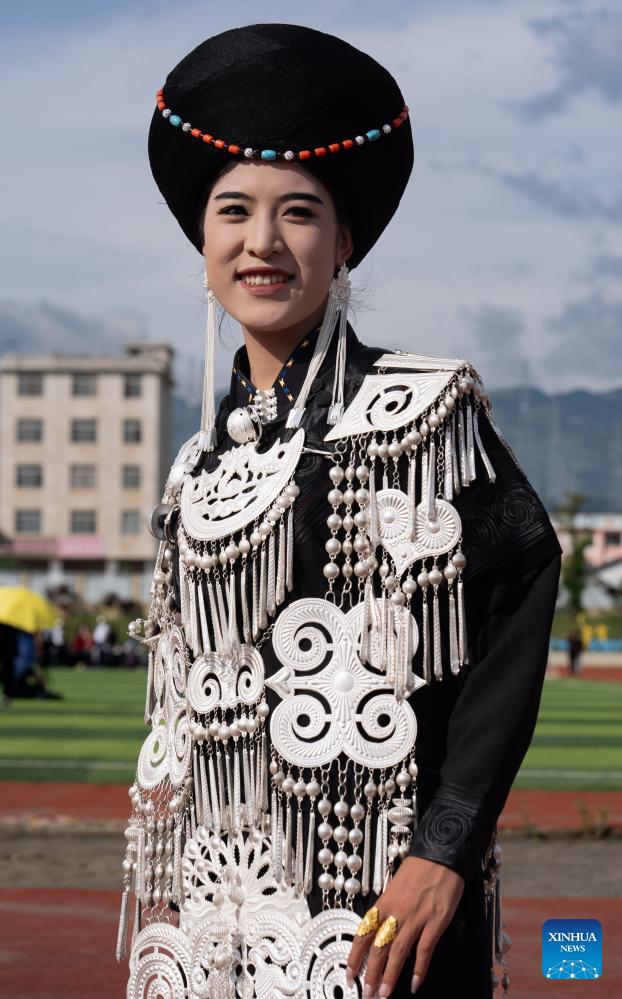 People dressed in traditional Yi costumes celebrate torch festival in China